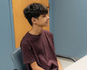 Andy Torres works with speech pathologist Megan Katz at a table